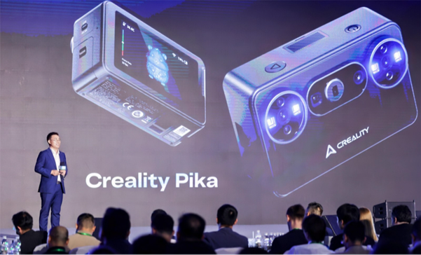 A close-up shot of the pocket-sized Creality Pika 3D scanner, showcasing its compact 260g form factor, built-in HD screen, and dual-light optical lens system designed for high-precision mobile scanning.